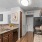 a kitchen with a stove microwave refrigerator and sink